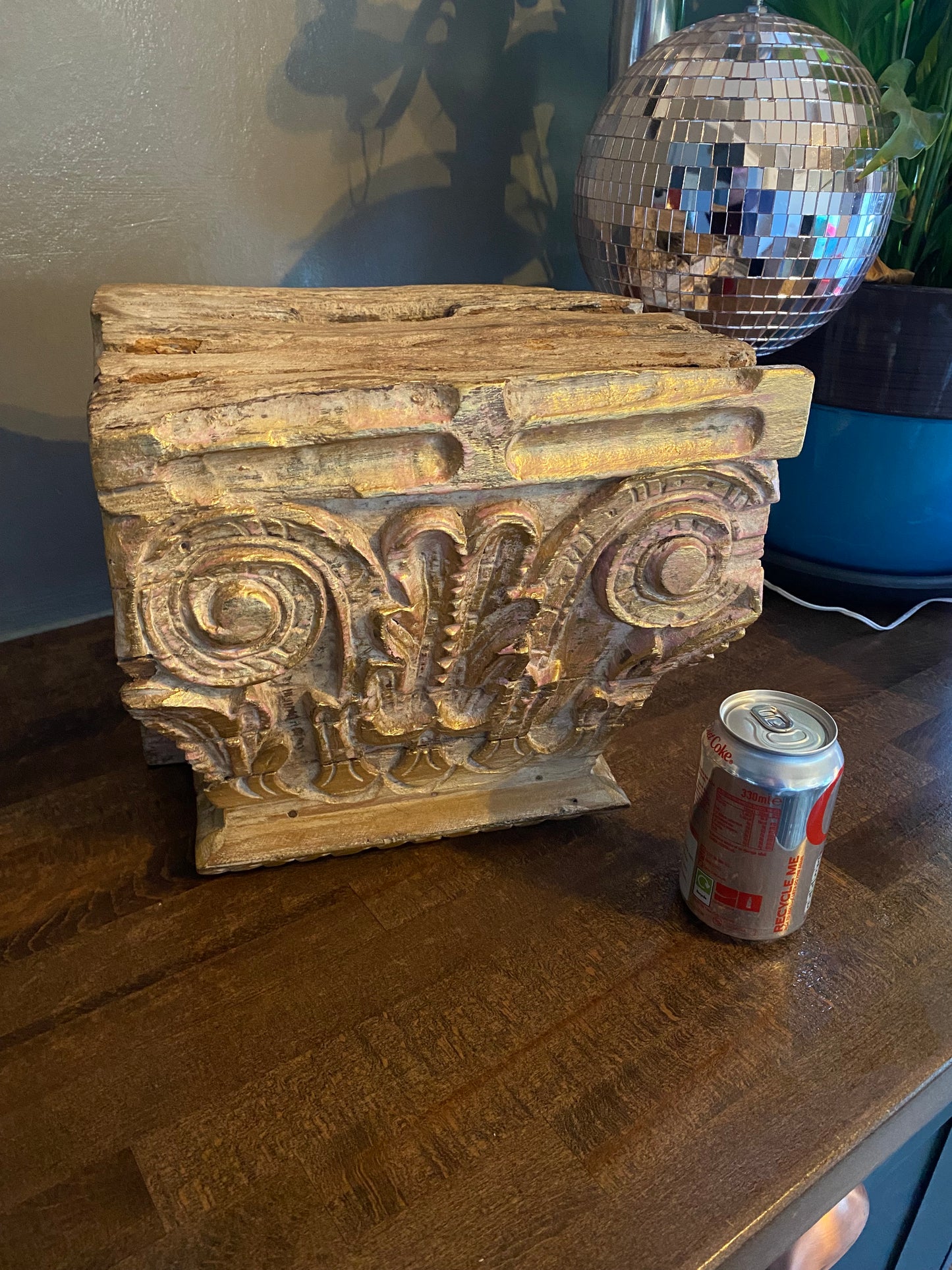 An antique oak corinthian column capital