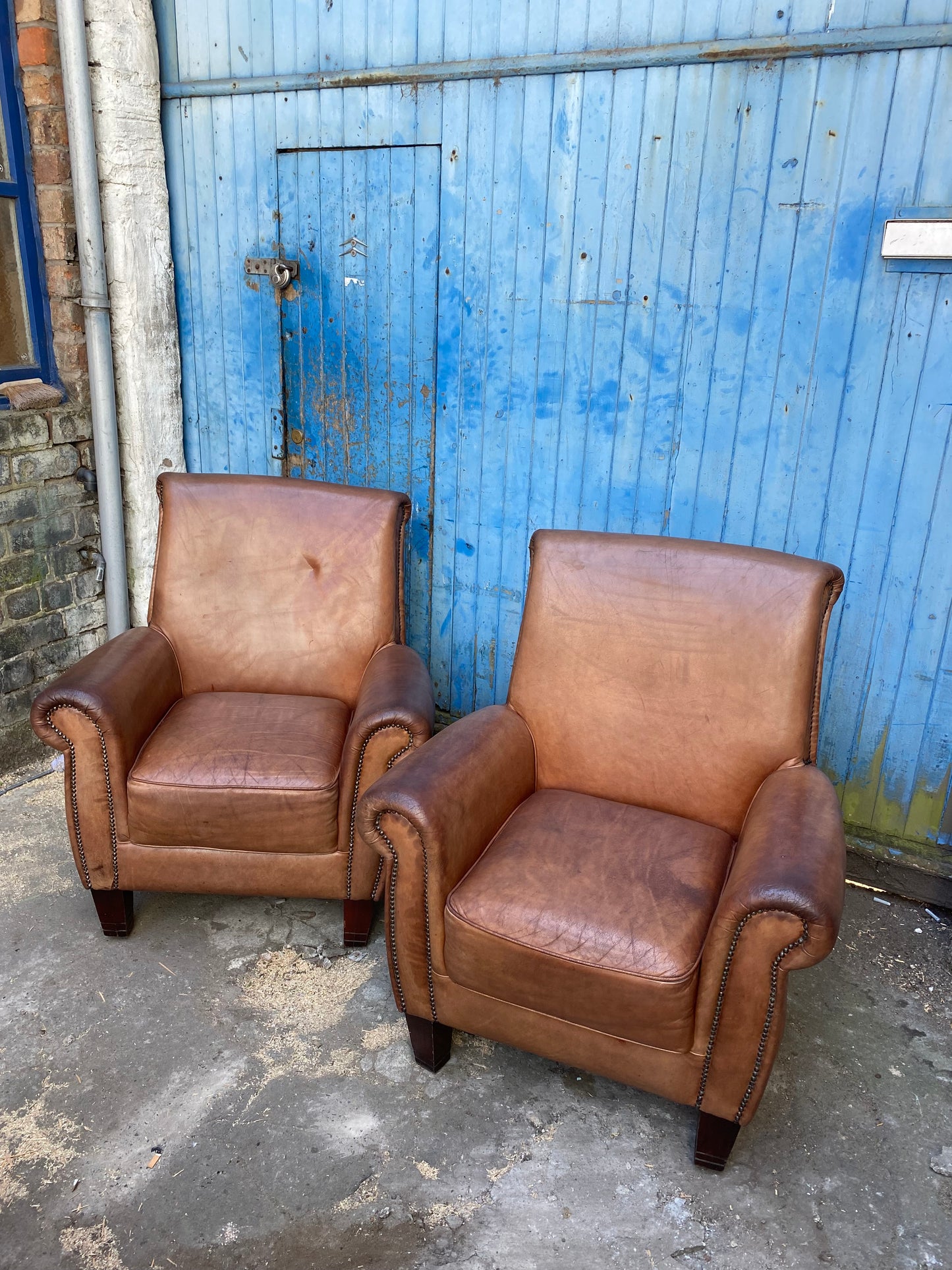 Pair of vintage tan leather armchairs (selling individually or as a pair)