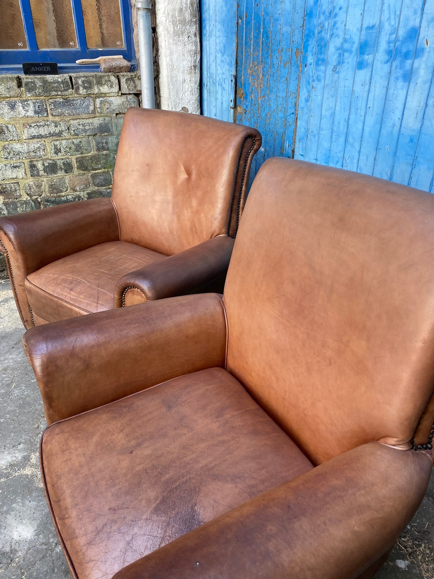 Pair of vintage tan leather armchairs (selling individually or as a pair)